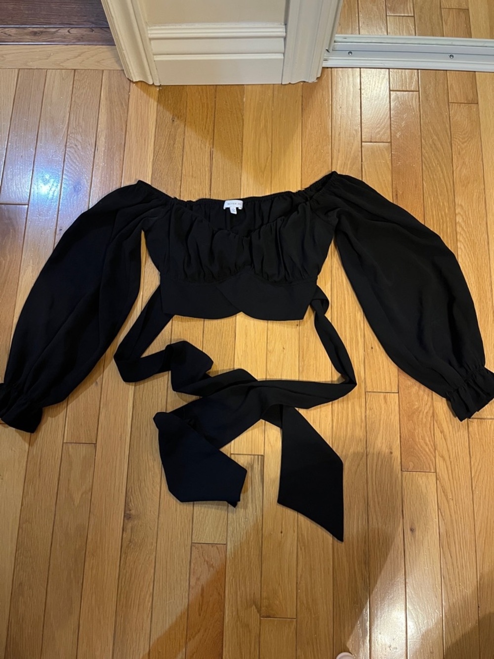 Better Be black cropped long sleeve top with puff sleeves and tie up detail